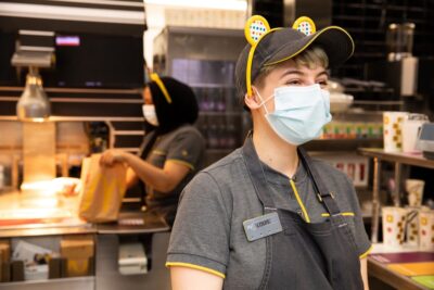 A McDonald's worker wearing Pudsey bear ears