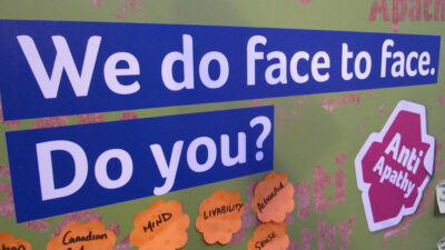We do face to face. Do you? Stall sign at IoF's 2010 Fundraising Convention in London. Photo: Howard Lake