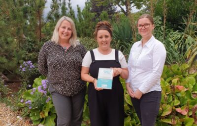 Three women from St Barnabas hospice with the award won for their Covid Donation Drive Thru
