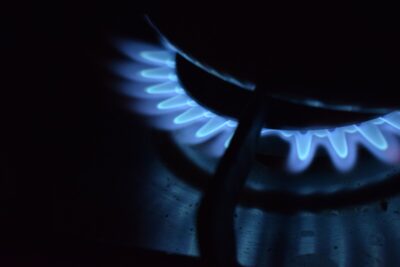the blue flames of a gas stove