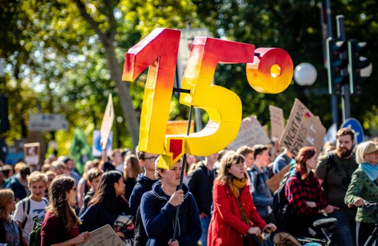1.5 degrees - big numerals held on a climate crisis campaign march in Germany in 2019. Photo: Unsplash.com