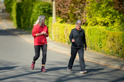 Two older women exercising in the street. Photo: David Tett.