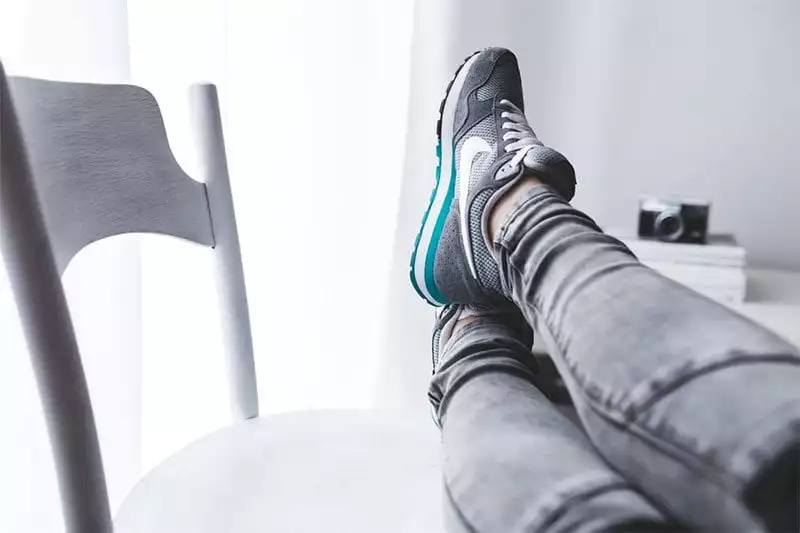 Pair of shoes on a chair. Someone is relaxing. Photo: Pexels.com