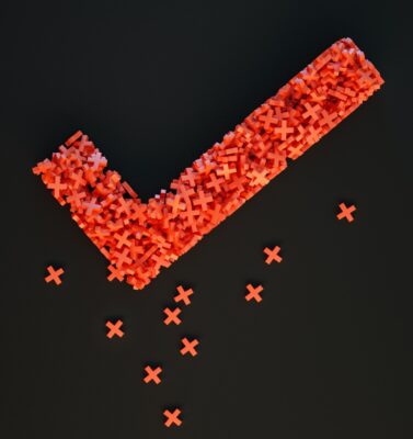 Right and wrong. Red tick made up of lots of small crosses. Photo: Unsplash.com