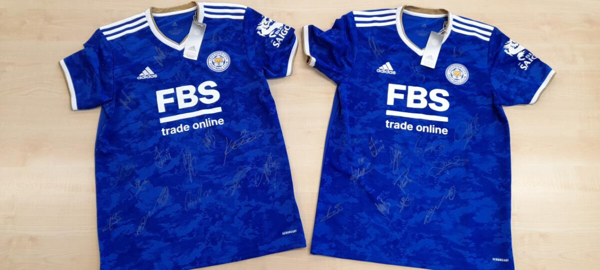 Two blue Leicester City signed football shirts