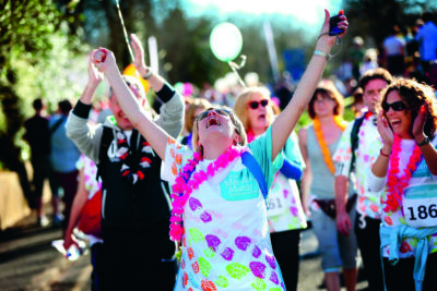 Laura Parker, a Banham Marsden March participant throws her arms in the air in celebration