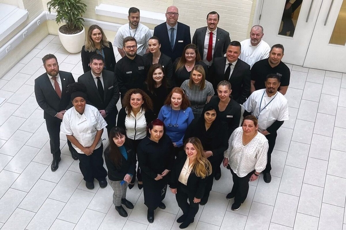 Staff from 30 Euston Square look up at the camera