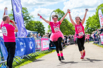 two women in pink do cRUK's Race for Life