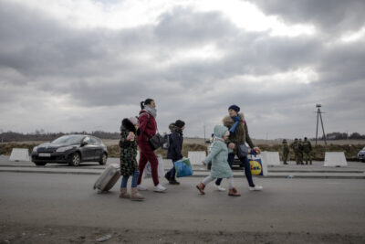 Ukrainian refugees cross the border into Poland on 2 March 2022