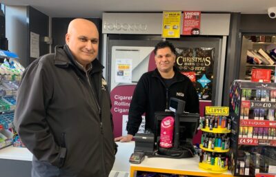 S&K Coventry's Nisa Local store owner Suk Kalm, with MADL collecting tin on the counter .
