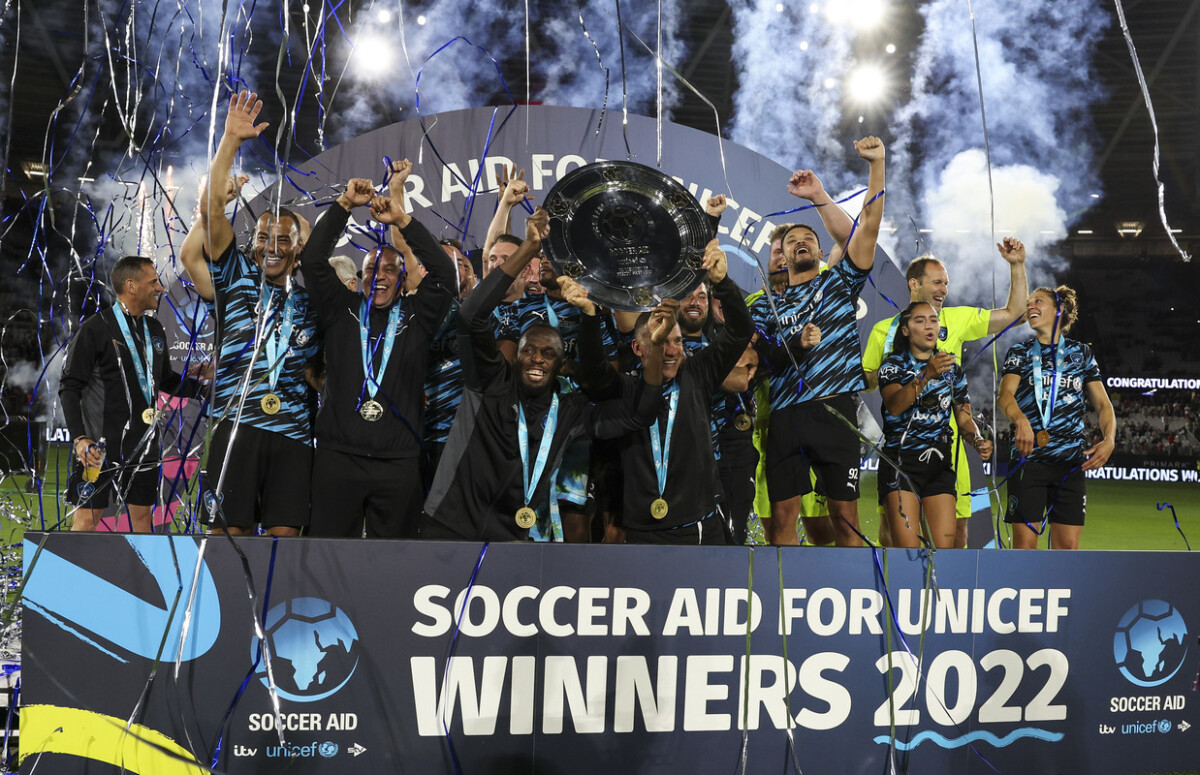 World XI players lifts the Freddy Shepherd Memorial Shield during Soccer Aid for UNICEF 2022 taking place on Sunday 12th June at the London Stadium, Stratford .Photographed by Ian Walton for UNICEF UK and Soccer Aid Productions ©UNICEF/Soccer Aid Productions/Stella Pictures.