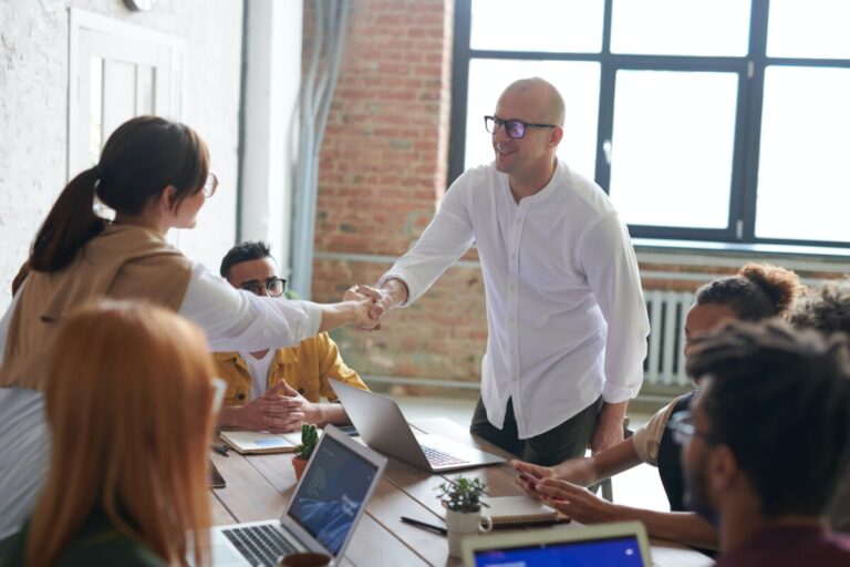 People shaking hands in an office. By Fauxels on Pexels