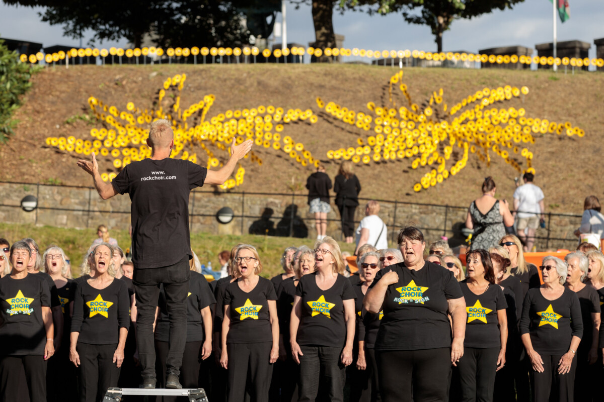 Rock choir performing at City Hospice's Forever Flowers 