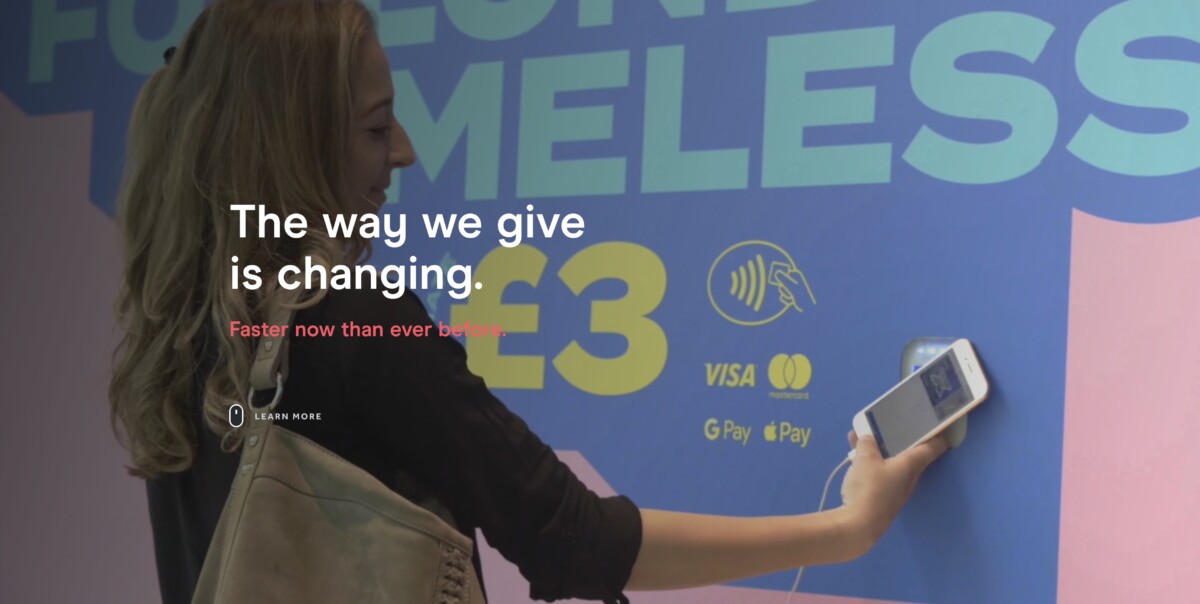Screenshot from GoodBox's website's front page (July 2022), featuring a woman donating £3 to homeless charities.