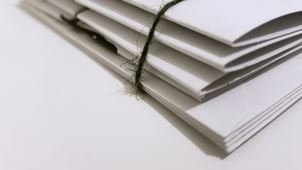 A stack of documents. By Sam Jean on Pexels