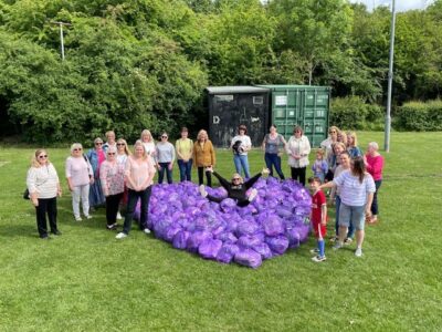 Members of Rebecca Butler’s Slimming World groups in Bingham pose with a purple heart made from the clothes they have donated as part of The Big Slimming World Clothes Throw 2022.