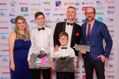 Child of Wales Awards 2022, Mercure Holland House Hotel, Cardiff - Courageous Family winner The Roberts Family with James Harper, Principality Building Society
