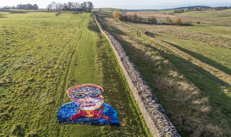 Three hundred blankets create a giant image of a pensioner trying to keep warm.