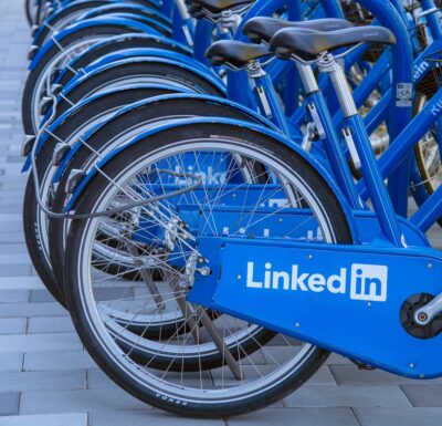 Photo: Bikes with LinkedIn logo on the mudguard, lined up together. Photo: Greg Bulla on Unsplash.