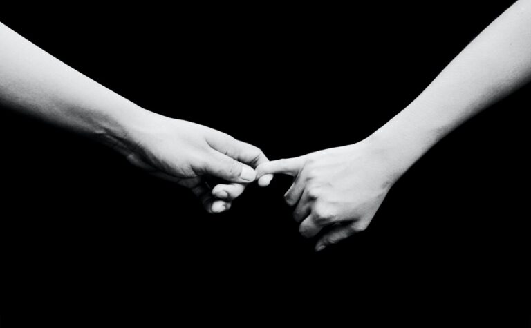 B/W photo of hands holding on. Photo: Neosiam on Pexels.com