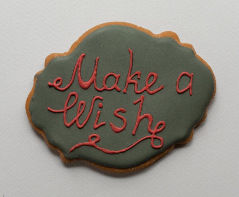 Make a wish - text iced onto a biscuit. Photo by Monstera: https://www.pexels.com/photo/holiday-inscription-on-baked-cookie-5709074/