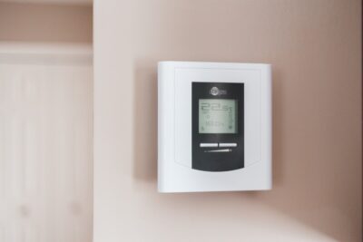 Thermostat on a wall. By Erik Mclean on Pexels