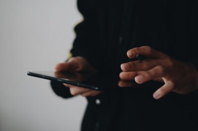 Hands on a tablet screen. Photo by Ekrulila on pexels