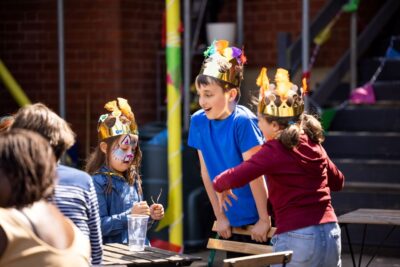 Stanley Arts – children play in crowns they've made