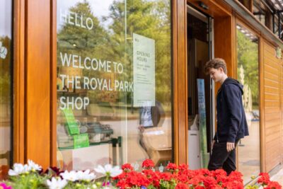 A teenage boy enters The Royal Parks shop