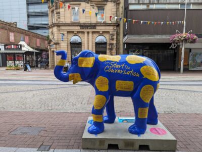 Elephant in the Room – a blue and yellow elephant talking about charitable legacies – part of Havens Hospice's Herd in the City