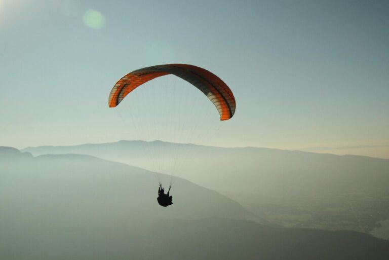 A parachute in a sunlit sky. By Jahoo Clouseau on Pexels