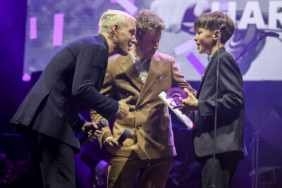 Jamie Laing (right) and Matt Edmondson (centre) presents Harry Smith with the Young Fundraiser of the Year award at the GoCardless JustGiving Awards.