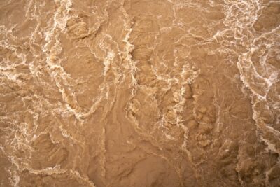 muddy water by wolfgang hasselmann on unsplash