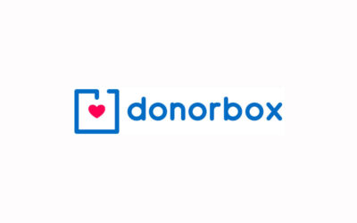 Donorbox logo, with a red heart inside a blue outline charity collecting box.