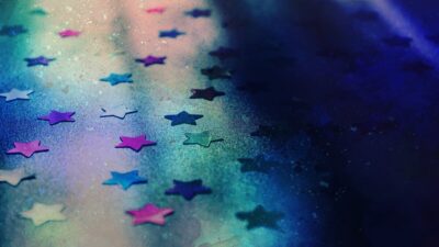 multicoloured stars against a dark background. By Suzy Hazelwood on Pexels