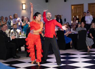 Fieldfisher Strictly contest - a couple in red dance
