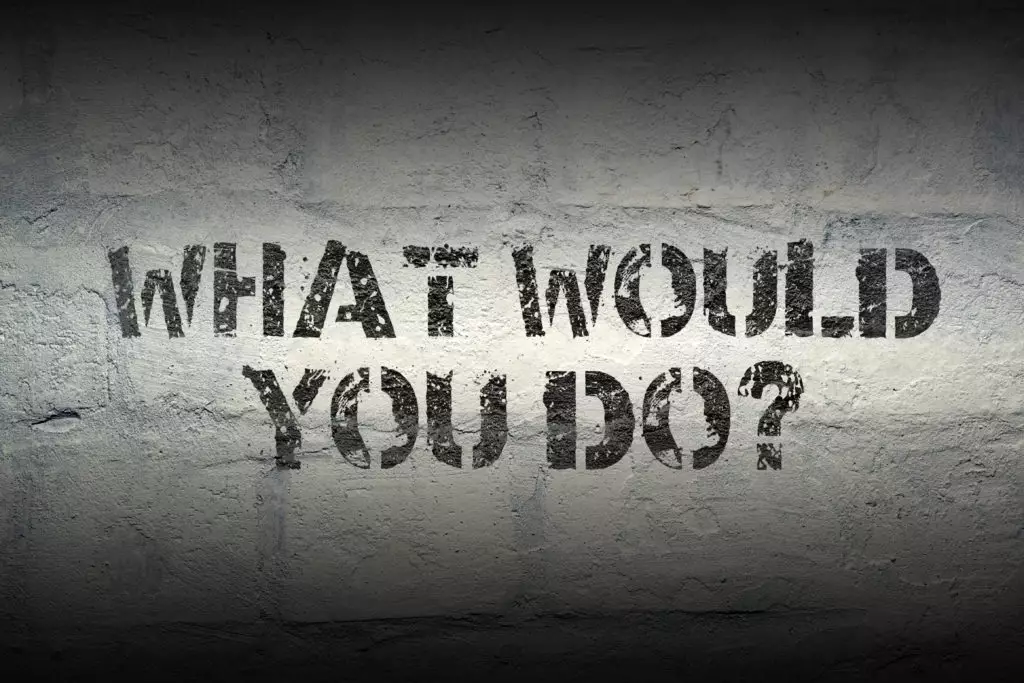 What would you do? Spray painted sign on a concrete wall