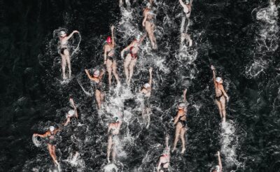 A host of swimmers viewed from above. By Sergio Souza
