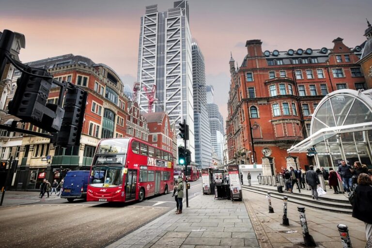 A London street scene with a red bus and a towerblock. by Albrecht Fietz on pixabay