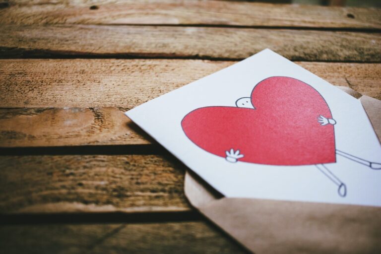 A valentine's day card peeping out of the envelope. By Freestockorg on pexels