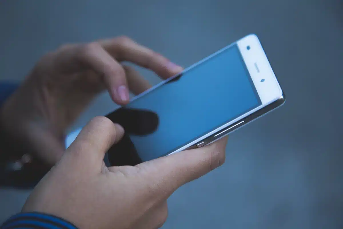 A close up on hands using a smartphone. By Pexels on Pixabay.