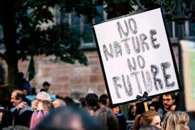 Protesters at a march with a sign saying No Nature No Future. By Markus Spiske on Pexels