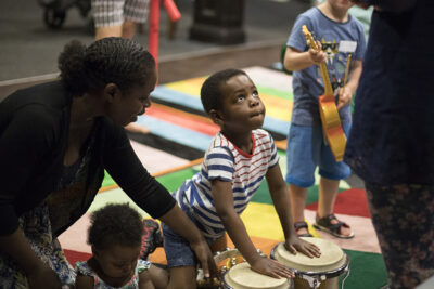 Pre-school age children playing with musical instruments – a picture from Youth Music