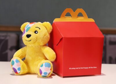 Pudsey and a McDonald's Happy Meal box without the smile and with the message It's okay not to feel happy all the time.
