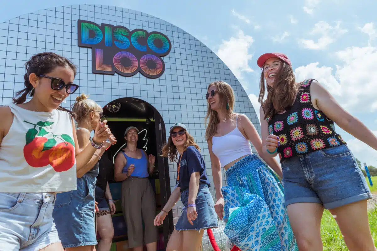 Glastonbury festivalgoers outside the event's Disco Loo.