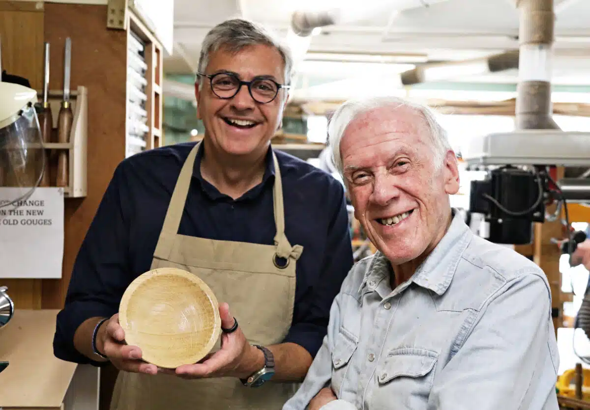 Two men with a wooden hand carved bowl - from UK Men's Sheds Association