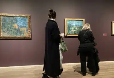 Women looking at paintings in the Tate Modern, London. Copyright: Melanie May