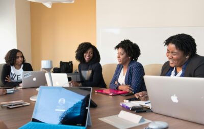 A group of Black women hold a business meeting/ By Divine Tech Girl on pexels