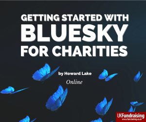 Getting started with Bluesky for charities. Course by Howard Lake. Blue butterflies fly through the dark to the light.