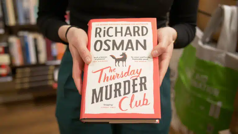 'The Thursday Murder Club' book by Richard Osman on display in Oxfam Islington shop.